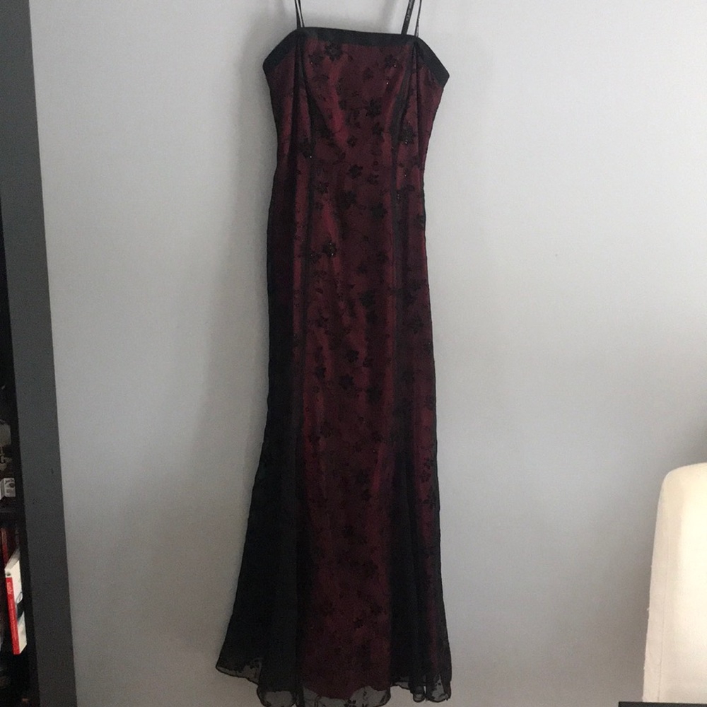Black strapless sheer dress, with red underneath.